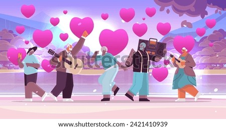 mix race senior people in love with bass clipping blaster recorder dancing and singing grandparents having fun active old age valentines day