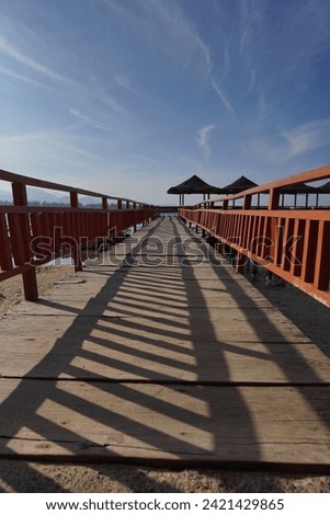 traditional wooden bridge connecting with beachside huts