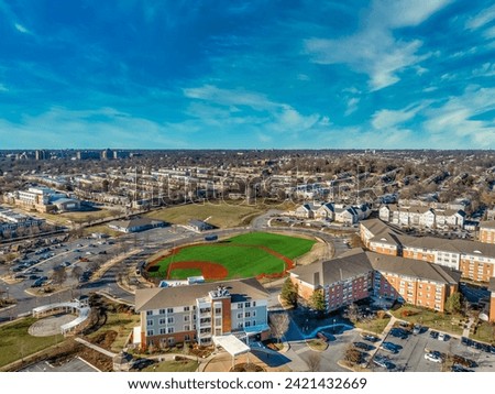 Aerial view of the former Memorial stadium redevelopment, now community recreational baseball field, mixed income senior residential complex, nursing center in Ednor gardens , Montebello Baltimore Royalty-Free Stock Photo #2421432669
