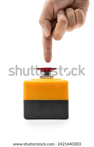 Stop Button and the Hand of Worker About to Press it. emergency stop button. Big Red emergency button or stop button for manual pressing. isolated on white background.