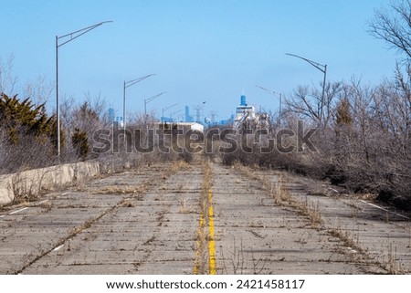 An abandoned stretch of U.S. Route 66 outside of Chicago. Royalty-Free Stock Photo #2421458117