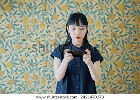 Young woman looking at smartphone screen