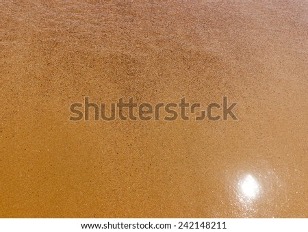 the golden sand of a beach at Pserimos island in Greece