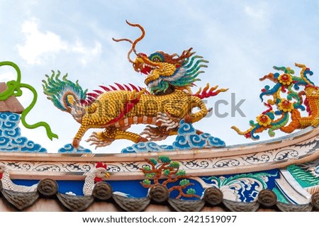 The Chinese dragon is an animal of fortune and power on the roof of a beautiful and auspicious Chinese temple on Religious New Year's Day.