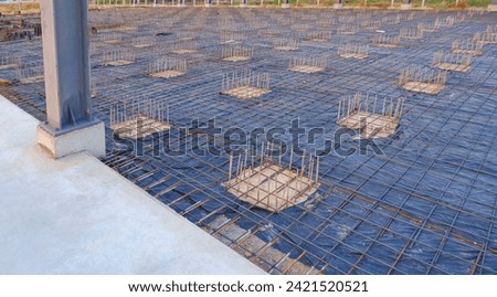 Deep Foundation Footing Reinforcement Steel with wire mesh structure on the Ground for reinforced Concrete Floor work in the Construction Site of Large Industrial Building Royalty-Free Stock Photo #2421520521