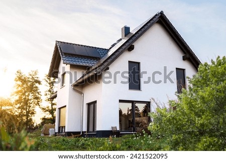 New Sustainable Single-Family Home with a Garden Royalty-Free Stock Photo #2421522095