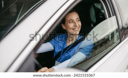 Female nurse sitting in car, going home from work. Female doctor driving car to work, on-call duty. Work-life balance of healthcare worker.