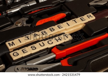 Symbol image employee search, Germany: In a toolbox, letter cubes spell out the words Mitarbeiter gesucht (Employees Wanted)