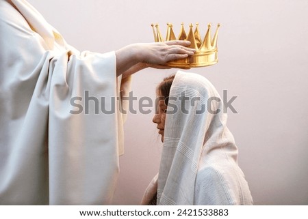 Retro old jew biblic faith happy male leader Lord priest ruler man arm give young lady hold gold tiara above veil cloth. Noble best win devot trophy smile joy face pray bible belief reign hero concept Royalty-Free Stock Photo #2421533883