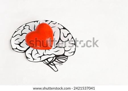 The head of a man with a heart inside on a light background. The concept of a lover or a kind person.