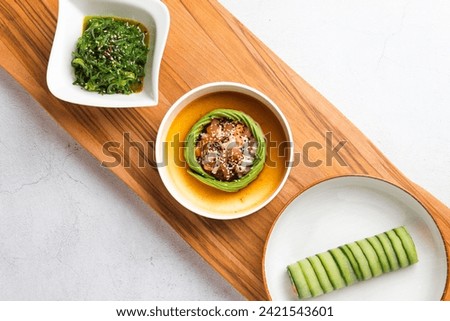 bright flatlay picture of asian appetizer dishes