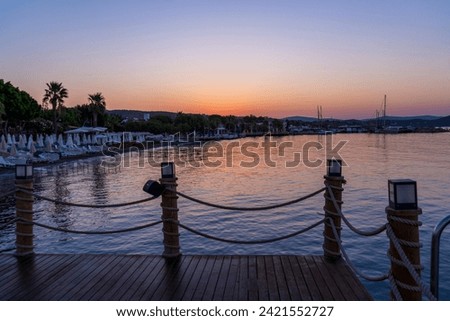 wooden dock with sunrise. beautiful colorful sunrise by the sea