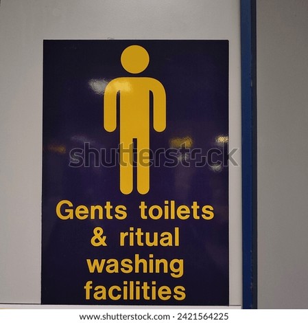 Sign on a door, indicating "Gents toilets and rituals washing facilities"