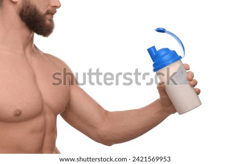 Young man with muscular body holding shaker of protein on white background, closeup Royalty-Free Stock Photo #2421569953