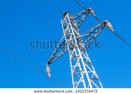 Pylon and high-voltage power line  Royalty-Free Stock Photo #2421576473