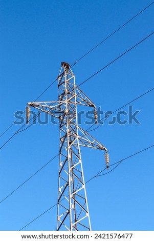 Pylon and high-voltage power line  Royalty-Free Stock Photo #2421576477