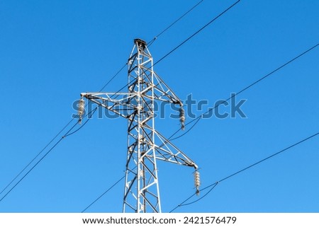 Pylon and high-voltage power line  Royalty-Free Stock Photo #2421576479