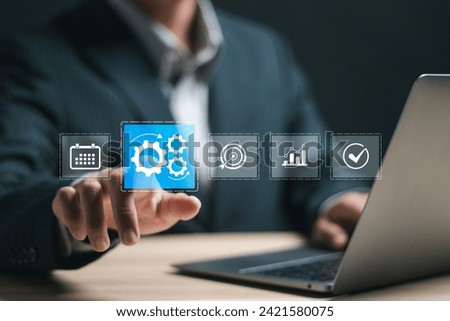 Automation concept. Businessman use laptop with virtual operations management technology related to business processes and workflows, high performance, monitoring and evaluation. Royalty-Free Stock Photo #2421580075