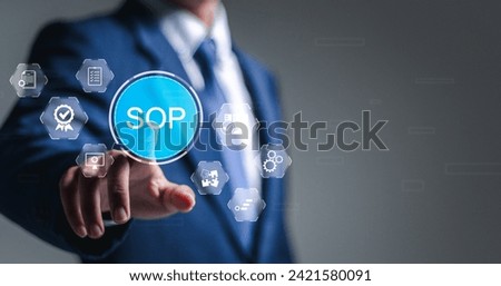 SOP, Standard operating procedure concept. Businessman touch virtual SOP icons for the standard operating procedure with instruction, quality, process, operation, sequence, workflow. Royalty-Free Stock Photo #2421580091