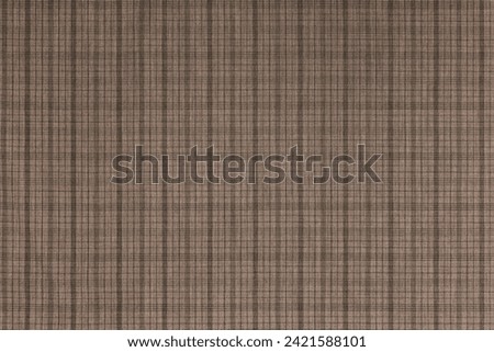 Brown checkered texture fabric, tartan pattern. Shirt fabric, tablecloth textile, linen plaid cloth, classic scottish check pattern. Backdrop, wallpaper, background.