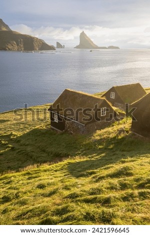 Houses with turf roofs, Bour village, vagar island, faroe islands, denmark, europe
Sunny summer view of Saksun village with typical turf-top houses.
Traveling concept background.