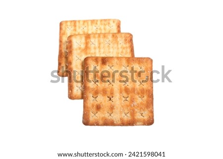 Three square homemade sugar butter crispy biscuit stack each other, one darker side on top, two whiter side at the back. Isolated on the white background. Top view commercial stock photo.