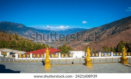 Wide view from the side of  Buddha Dordenma Statue in Bhutan, looking into the valley and mountains in the distance