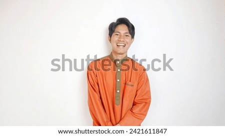 Handsome Asian Muslim man with cool style on white background