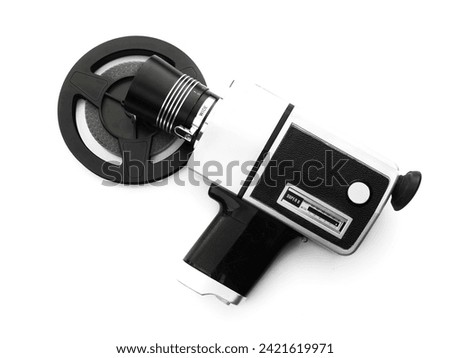 Super 8 mm film old camera and film reel isolated on white