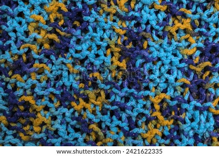 Knitted wool texture, cozy and warm patterned fabric surface, soft and fuzzy color background.