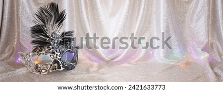 Photo of elegant and delicate Venetian mask over gold background Royalty-Free Stock Photo #2421633773