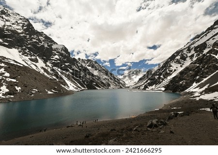 Laguna del Inca is a lake in the Cordillera region, Chile, near the border with Argentina. The lake is in the Portillo region: incredible landscape, blue sky, reflection of the water, in summer Royalty-Free Stock Photo #2421666295