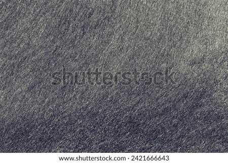 Metal black felt material. Surface of felted fabric texture abstract background in dark gray color. 