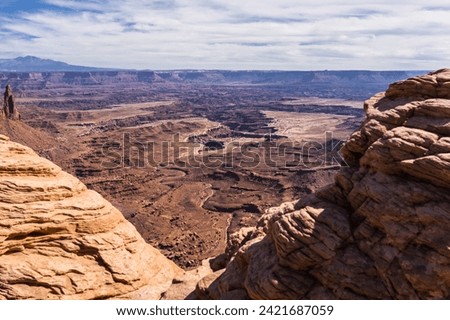 United States. Utah. Canyonlands National Park. From Mesa Arch, canyons with La Sal Mountains in the background.  Royalty-Free Stock Photo #2421687059