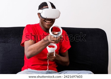 young black man playing games with a virtual reality headset