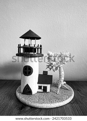 Lighthouse made of paper and book, beautiful and unique gift and candlestick or decorative lamps in childroom, picture in black and white