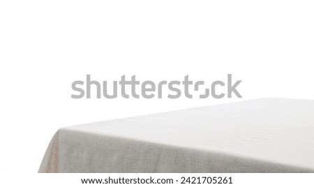 Table with light tablecloth isolated on white Royalty-Free Stock Photo #2421705261