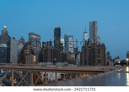 Evening panorama of New York skyscrapers on Manhattan Island view from the Brooklyn Bridge