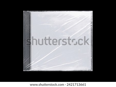 CD case on black background. Isolated transparent disk mockup. Clean cover box template. Royalty-Free Stock Photo #2421713661