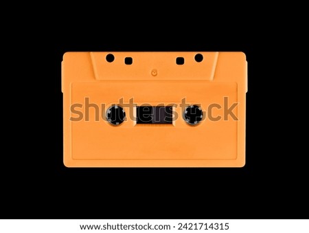 Cassette tape on black background. Isolated transparent mockup. Clean cover box template. Royalty-Free Stock Photo #2421714315