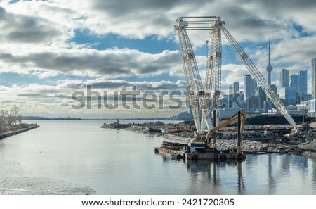 The newly created mouth of the Don River into Lake Ontario near downtown Toronto. The ongoing mega-project is fashioning  a more natural outlet for the important waterway and revitalizing a huge area. Royalty-Free Stock Photo #2421720305