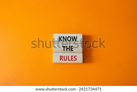Know the rules symbol. Wooden blocks with words Know the rules. Beautiful orange background. Business and Know the rules concept. Copy space.