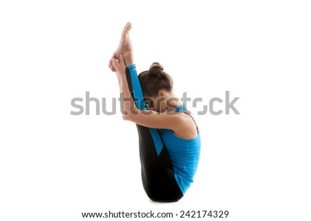 Sporty yoga girl on white background bending in half