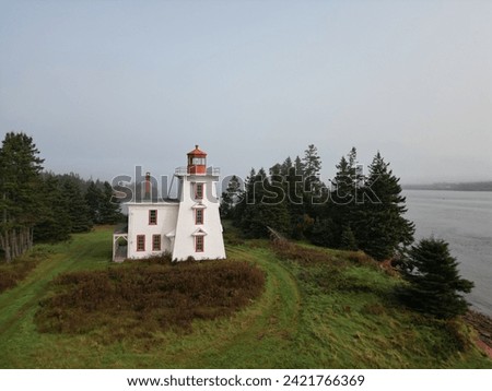 Lighthouse at Blockhouse in Prince Edward Island Royalty-Free Stock Photo #2421766369
