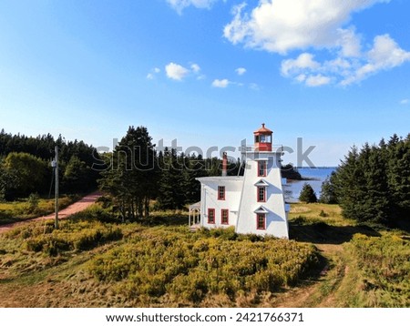 Lighthouse at Blockhouse in Prince Edward Island Royalty-Free Stock Photo #2421766371