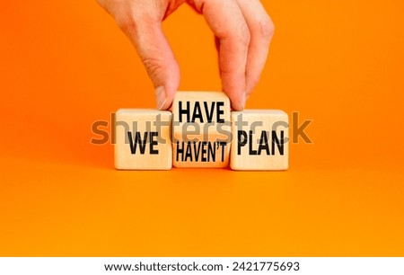 We have or not plan symbol. Concept word We have or have not plan on beautiful wooden cubes. Beautiful orange table orange background. Business and we have or not plan concept. Copy space.