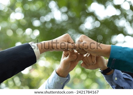 World environment day. Global community teamwork, CSR, and ESG environmental energy-saving collaboration of hands stack together for sustainable development goals. People join for cooperation success. Royalty-Free Stock Photo #2421784167