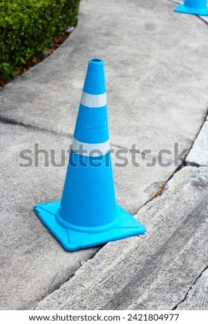 Street with blue traffic cone