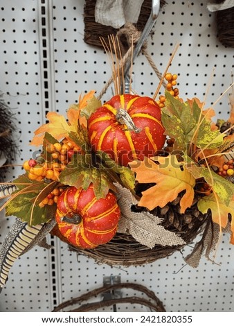 Halloween decorations. Autumn atmosphere. Leaves, pumpkins, orange color, warm and sunshine.