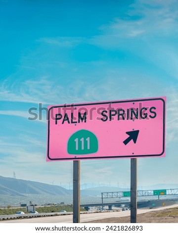 Palm Springs pink exit sign for Highway 111 located on the I-10 freeway